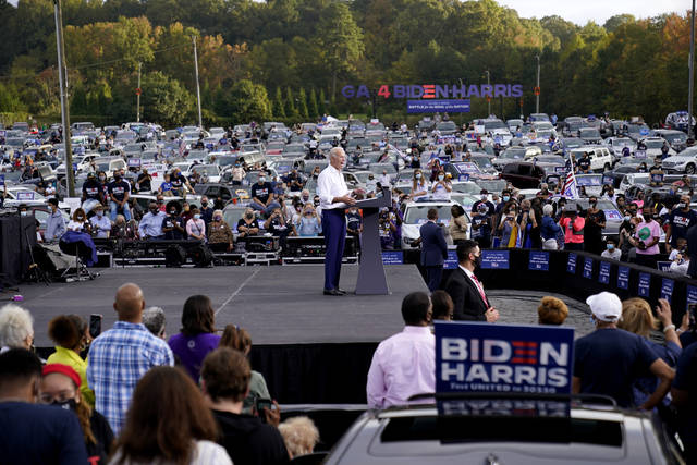 <p>FILE - Democratic presidential candidate former Vice President Joe Biden speaks at a drive-in rally in Atlanta, on Oct. 27, 2020. After a historic season, winter is coming at the drive-in. Summer and early fall have seen the old drive-in transformed into a surprisingly elastic omnibus of pandemic-era gathering. . (AP Photo/Andrew Harnik, File)</p>