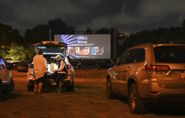125945464_web1_125945464-d57690a6c4fe4e079406287c71ab68aa
FILE - Filmgoers attend the Nomadland screening at the Queens Drive-In at the New York Hall of Science during the 58th New York Film Festival in New York on Sept. 26, 2020. After a historic season, winter is coming at the drive-in. Summer and early fall have seen the old drive-in transformed into a surprisingly elastic omnibus of pandemic-era gathering. Red-carpet premieres that would normally consume Lincoln Center uprooted to drive-ins. (Photo by Evan Agostini/Invision/AP, File)