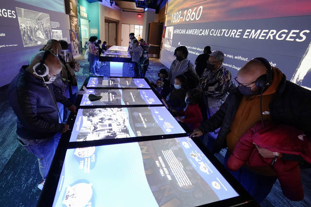 <p>People look at an interactive exhibit in the National Museum of African American Music in Nashville, Tenn.</p>
<p>AP photo</p>