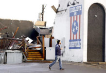 
			
				                                In this March 3, 2020, file photo, a man walks by The Basement East, a live music venue, on March 3, 2020, after a tornado hit Nashville, Tenn. It has been a year since deadly storms tore across Nashville and other parts of Tennessee, killing more than 20 people and damaging more than 140 buildings.
 
			
		