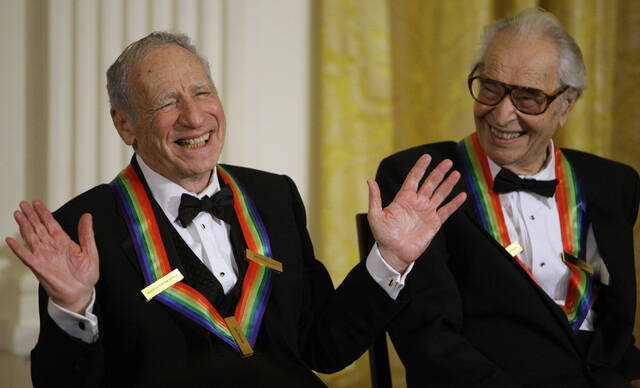 <p>FILE - Kennedy Center honorees Mel Brooks, left, works the crowd as Dave Brubeck laughs at the White House in Washington on Dec. 6, 2009. Brooks released a memoir, “All About Me!: My Remarkable Life in Show Business.” (AP Photo/Alex Brandon, File)</p>