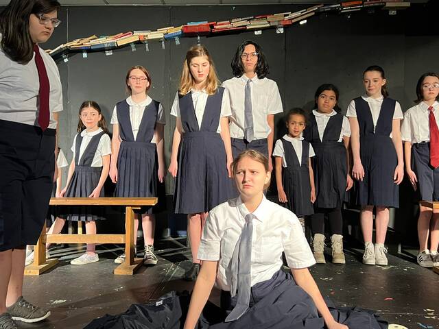 129398637_web1_Niegelawake
Students rally to protect one of their classmates from the evil Trunchbull during a recent rehearsal at Act Out Theatre Group in Taylor. First row from left, are Vivian Santiago, Covington Township; and Jordan Elliott, Scranton. Second row, are Violet Stefanski, Dunmore; Cari Altenhain, Moosic; Zoey Schlitter, Dunmore; Miguel Rodriguez, Moosic; Thea McKean, Scranton; Amya McKean, Scranton; Chloe Joyce, Scranton; and Rachel Hitchcock, Dunmore.