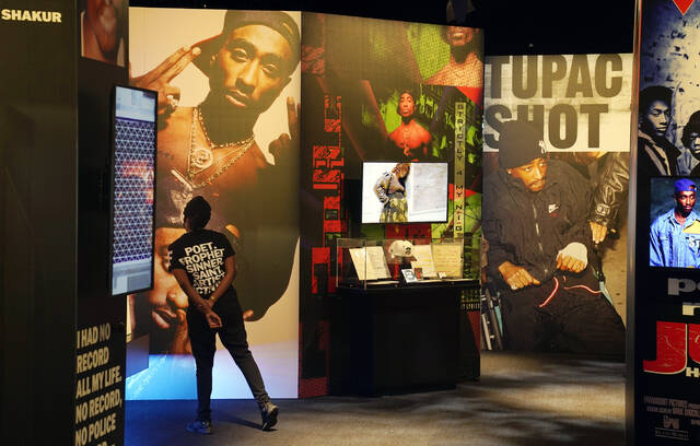 130024503_web1_130024503-a2ca859c48154e73ad8e8fcc585bf1e6
A visitor observes a display of late hip hop artist Tupac Shakur during the press preview day for the Tupac Shakur. Wake Me When Im Free exhibition, Thursday, Jan. 20, 2022, at The Canvas at L.A. Live in Los Angeles. The unsolved killing of Shakur has taken a major turn. Duane Keffe D Davis was arrested Friday morning, although the exact charge or charges were not immediately clear, according to two officials with first-hand knowledge of the arrest. The renewed activity comes nearly 30 years after Shakur was gunned down on Sept. 7, 1996.
AP photo