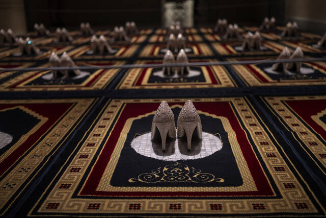 130158159_web1_130158159-e44a5c511dc14727badbc7aaa4013b20
Silence, an installation by French Algerian artist Zoulikha Bouabdellah that displays 30 pairs of stiletto heels on the same number of Islamic prayer rugs, is photographed at Barcelonas Museum of Forbidden Art in Barcelona, Spain, on Nov. 8. Bouabdellah agreed to have her work removed from a museum in Clichy, France, after the 2015 attacks in Paris against the staff of the Charlie Hebdo satirical newspaper, which had published cartoons of the Prophet Muhammad. A new museum in Barcelona is offering a second chance to controversial artworks that have suffered censorship for religious, sexual, political or commercial reasons.
AP photo