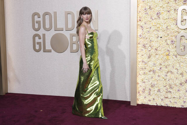 130279163_web1_AP24008051055272
Taylor Swift arrives at the 81st Golden Globe Awards on Sunday at the Beverly Hilton in Beverly Hills, Calif.
AP photo