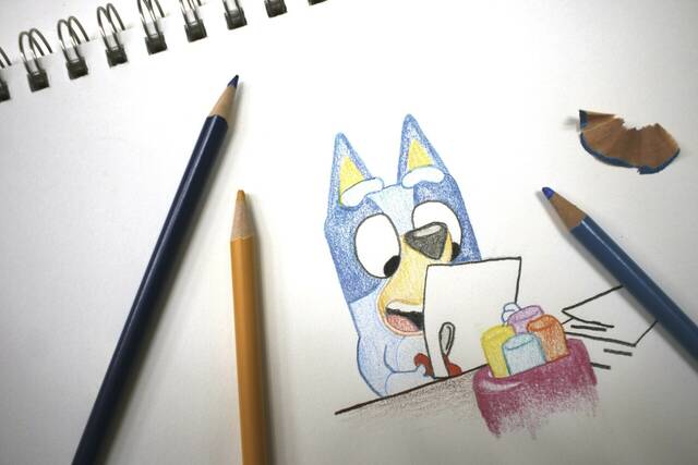 130552620_web1_130552620-e1a1e9c2785242c2b47194a3e0291a87
Colored pencils sit around a drawing of Bluey the Australian kids television program character on a sketch pad Friday in Phoenix, Ariz.
AP photo