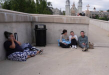 
			
				                                People shelter behind a wall on the Villanova University campus in Villanova on Thursday where an active shooter was reported.
                                 AP Photo

			
		