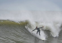
			
				                                A surfer rides waves bolstered by Hurricane Erin at Rockaway Beach in the Queens borough of New York on Thursday.
                                 AP Photo

			
		