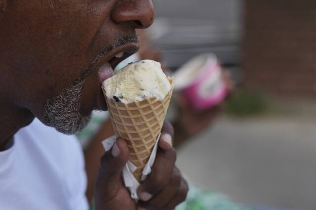131770524_web1_131770524-1826d8e4e2b1426f88c25d90ffd9eb71
A person eats ice cream in Cincinnati on Friday.
AP Photo