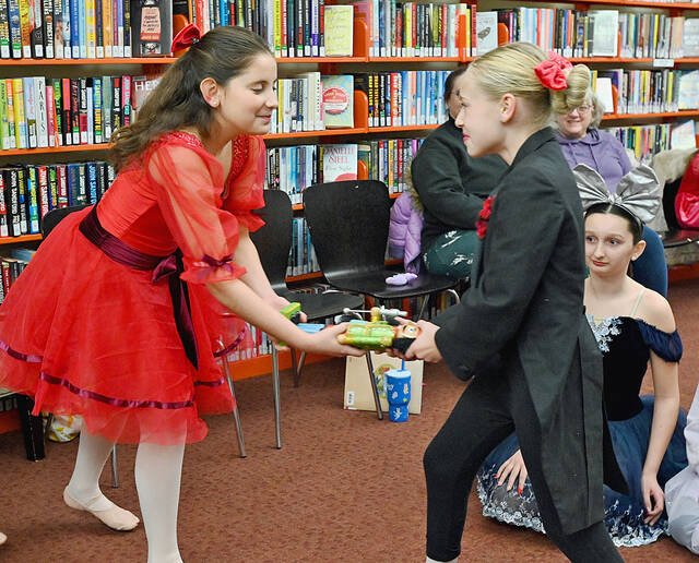 <p>Olivia Selenski as Clara and Kennedy Shortz as her mischievous brother, Fritz, tussle over the Nutcracker during a preview of ‘The Nutcracker Spectacular,’ held at the West Pittston Library. The Dance Theatre of Wilkes-Barre will present the show at 3 p.m. Sunday, Dec. 21 at the F.M. Kirby Center for the Performing Arts.</p>
<p>Tony Callaio | For Times Leader</p>