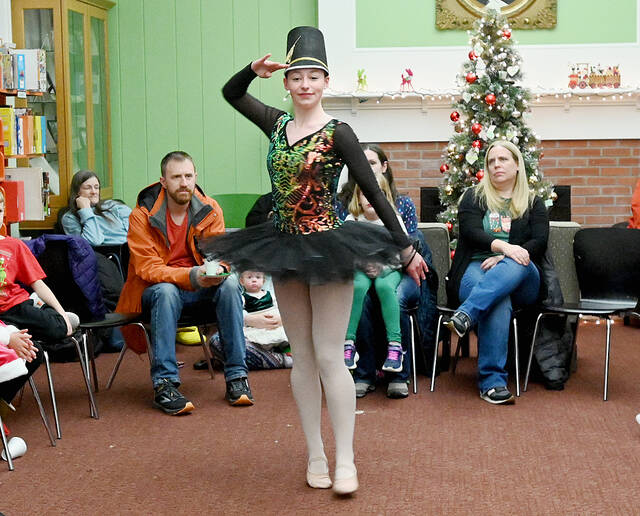 <p>Kinley Park of the Dance Theater of Wilkes-Barre salutes during her solo as a soldier doll.</p>
<p>Tony Callaio | For Times Leader</p>