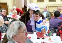 
			
				                                Betty Lee Devers, in character as Dolly Levy from Hello, Dolly, hugs a young guest at the St. Davids Tea, held on Tuesday evening at Dr. Edwards Memorial Congregational Church in Edwardsville.
                                 Mark Guydish | Times Leader

			
		