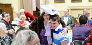 
			
				                                Betty Lee Devers, in character as Dolly Levy from Hello, Dolly, hugs a young guest at the St. Davids Tea, held on Tuesday evening at Dr. Edwards Memorial Congregational Church in Edwardsville.
                                 Mark Guydish | Times Leader

			
		