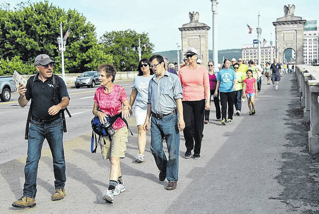 <p>While most Y Walk Wednesday hikes are planned for the East side of the Susquehanna River, a few will take participants over the Market Street Bridge to Kirby Park or other locations on the West side. These participants from a previous hike are walking across the bridge to visit Kirby Park’s natural area.</p>
<p>Times Leader File Photo</p>