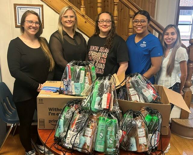 132436120_web1_LCCC-Dental-Hygiene-Donation
Presenting the kits at the Childrens Service Center were, from left: CSCs Lindsay Bower, director of education, and Sydney Szafranovicz, director of partial hospitalization; and LCCCs SADHA Officers Nancy Morris of Wilkes-Barre (president), Estefany Veras of Wilkes-Barre (secretary), and Andrea Lopez of Montrose (treasurer).
Submitted Photo